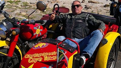 Motorcycle Side Car Trips Man Sitting In Yellow and Red Sidecar