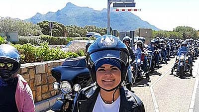 cape corportate tours harley davidson chauffeur rides pillion rider with line of harleys