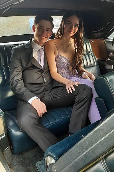 chauffeur rentals for matric balls matric dance couple sitting in cadillac-min