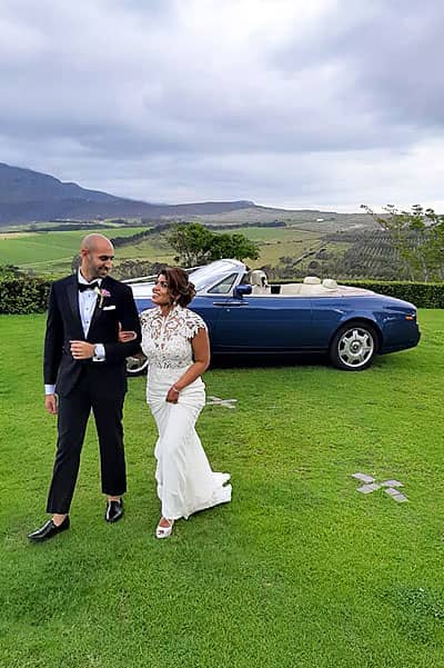 chauffeur rentals for weddings bride and groom with blue rolls royce phantom