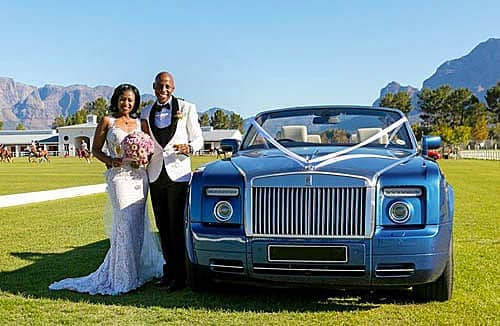 Chauffeur Rentals For Weddings Couple Next To Rolls Royce Phantom