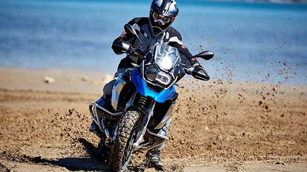 cape corporate tours bmw motorcycle rentals blue bmw bike sliding through mud spraying