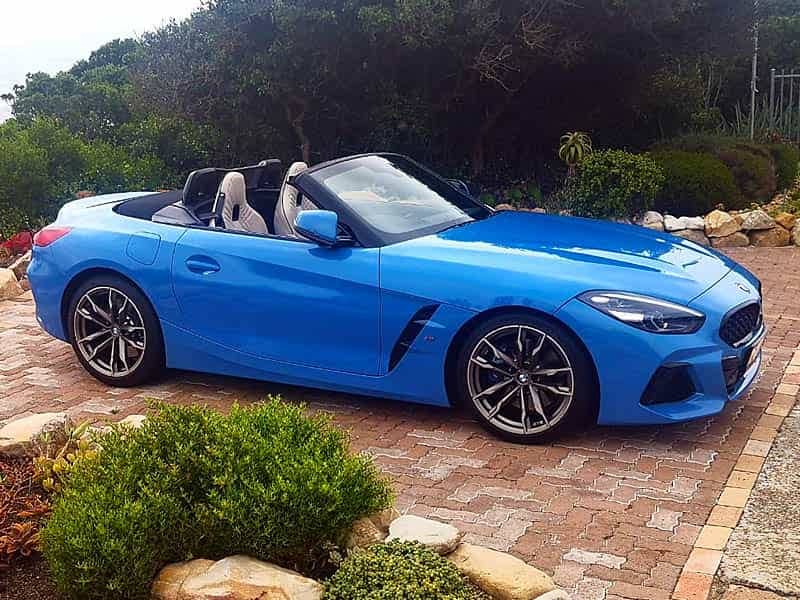 luxury cars blue bmw convertible in driveway