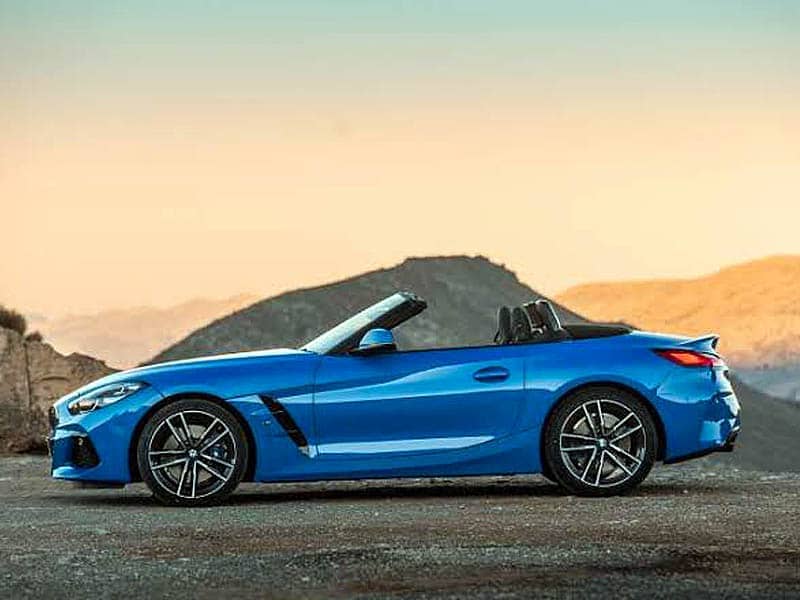 luxury cars blue bmw convertible on mountain